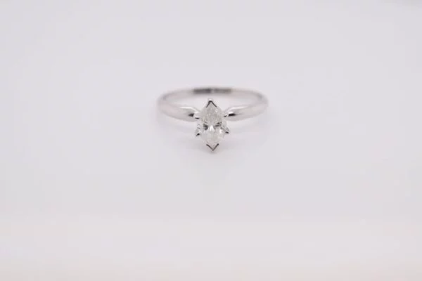 Solitaire Elegant 14K white gold marquise diamond ring with a diamond measuring 7x4.73 mm and weighing 0.68 carat. Ring size 6.25 US.