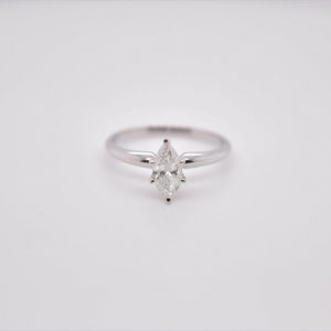 Elegant 14K white gold solitaire ring with a marquise-shaped diamond, measuring 8x4.14 mm and weighing 0.58 carat. Ring size 6 US.