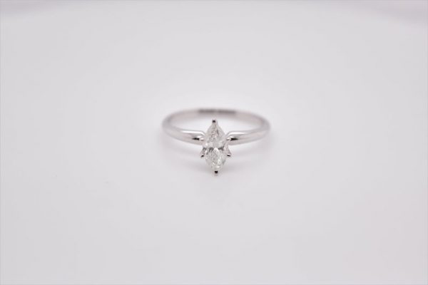 Elegant 14K white gold solitaire ring with a marquise-shaped diamond, measuring 8x4.14 mm and weighing 0.58 carat. Ring size 6 US.