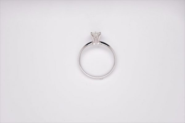 Elegant 14K white gold solitaire ring with a marquise-shaped diamond, measuring 8x4.14 mm and weighing 0.58 carat. Ring size 6 US.