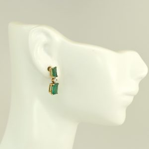 14K gold earrings with oval emeralds and diamonds. Elegant design with polished finish. Ideal gift, featuring high-quality authentic emeralds. SKU: ER2122.