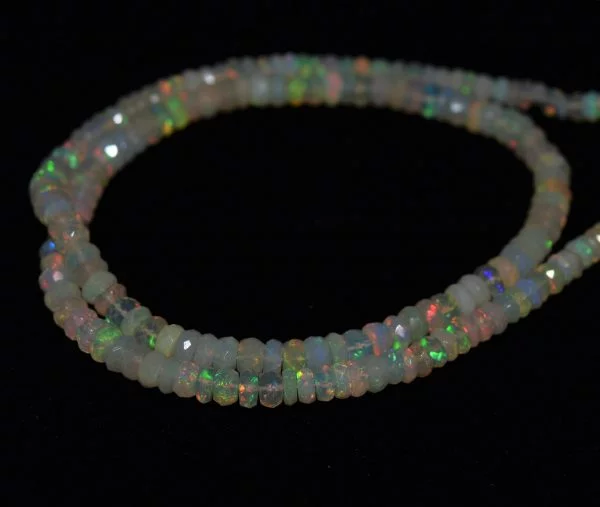 Natural opal Strand of natural Ethiopian opal faceted round beads, 4.2-5 mm, 47-49 carats, 17 inches long. Opal promotes creativity, memory, and self-worth.