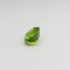 Natural peridot stone oval gemstone, 15.8x13.8x9.1 mm, 14.02 carats. August birthstone known for its positive energy and abundance.