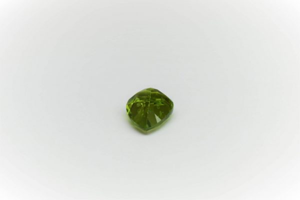 Natural peridot stone pear-shaped gemstone, 19x12.8x8.1 mm, 12.91 carats. August birthstone known for its positive energy and abundance.