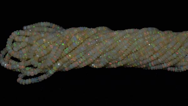 Strand of natural Ethiopian opal faceted round beads, 4.2-5 mm, 47-49 carats, 17 inches long. Opal promotes creativity, memory, and self-worth.