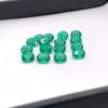 Natural emerald gemstone, oval shape, rich green color with small inclusions. Size 6x5 mm, weight 0.40-0.62 carats. Ideal for earrings, rings, or pendants. Origin: Zambia. May birthstone. Cut and polished in India.