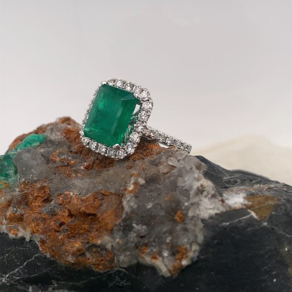 Certified natural Authenticate emerald ring featuring a genuine 2.75 carat emerald and 1.02 carats of diamond accents set in 14K white gold. This authentic and high-quality fine jewelry emerald ring is handcrafted and perfect for collectors or anyone seeking a unique, vintage piece. Its classic elegance and exquisite attention to detail make it a must-have addition to any precious gemstone ring collection.